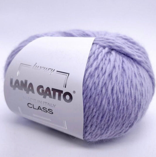 Ball of lavender yarn with a 'Lana Gatto' label on a light purple background
