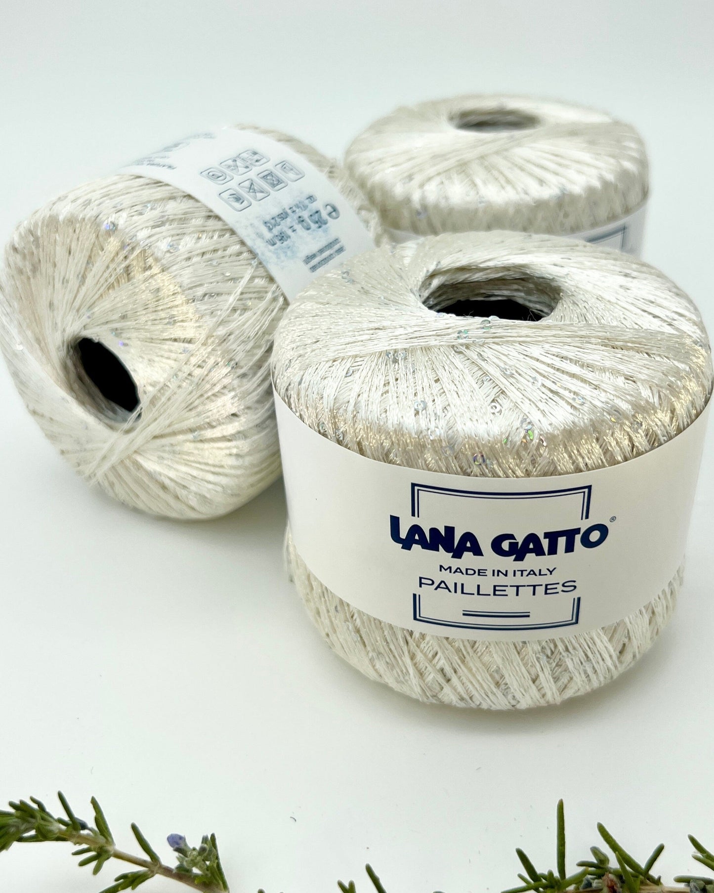 Lana Gatto Paillettes yarn in shimmering pastel tones, with delicate 2mm sequins, lightweight polyester yarn ideal for adding sparkle to knit or crochet projects. Made in Italy. 8599 white color.