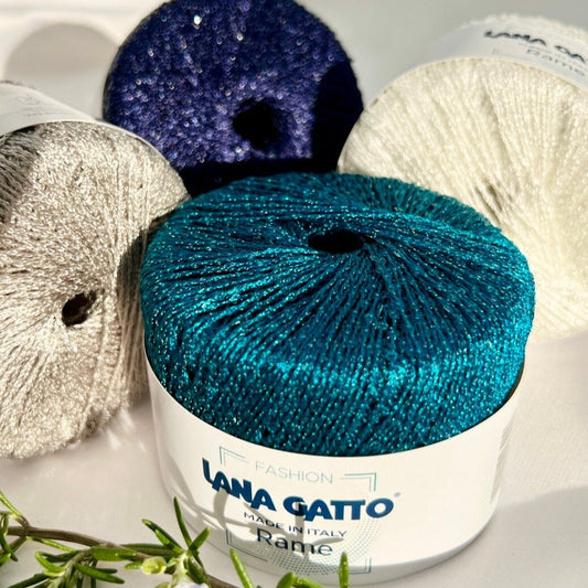 Yarn balls with 'Lana Gatto' branding on a white background
