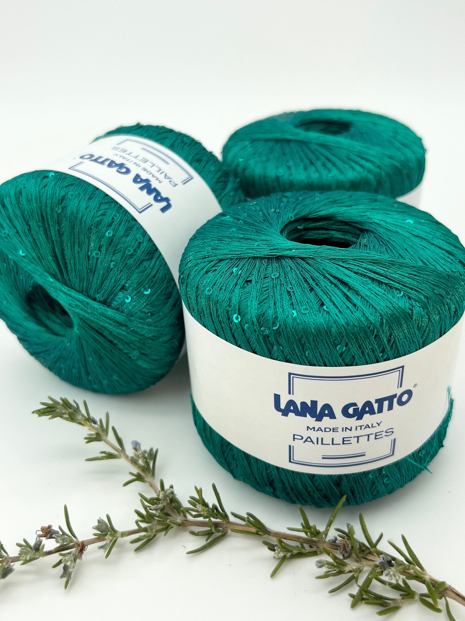 Lana Gatto Paillettes yarn in shimmering pastel tones, with delicate 2mm sequins, lightweight polyester yarn ideal for adding sparkle to knit or crochet projects. Made in Italy. 8937 green color.