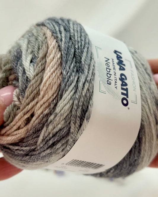 Multicolored yarn ball with a label on a white background