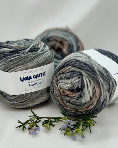 Three skeins of yarn with 'Lana Gato' labels on a white background