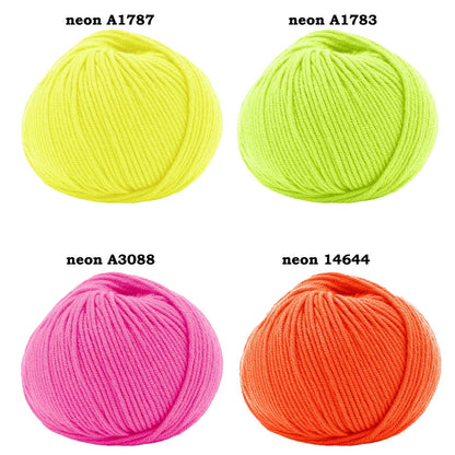 Four balls of neon yarn in different colors on a white background