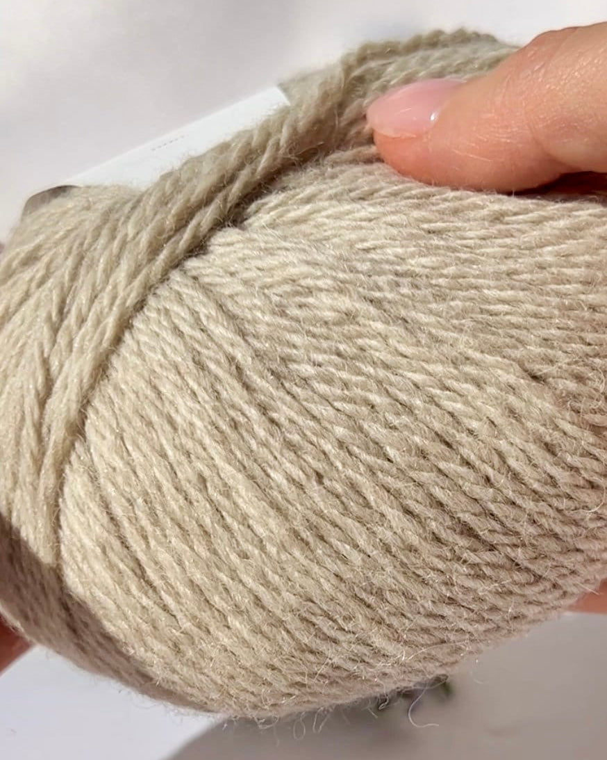Luxurious iDOKNiT Italian yarn blend of 70% Baby Alpaca and 30% Extrafine Merino Wool in DK weight, featuring a soft halo and plush texture for elegant knitwear.