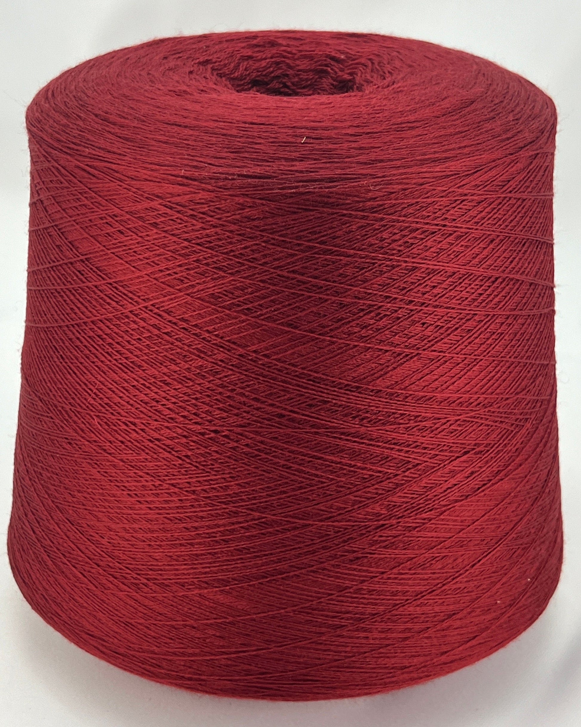 Red spool of yarn on a white background