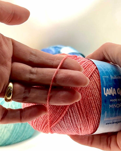 Luxury Italian designer yarn collection for iDOKNiT, featuring premium natural fibers on cones for professional hand-knit and machine-knitting projects.