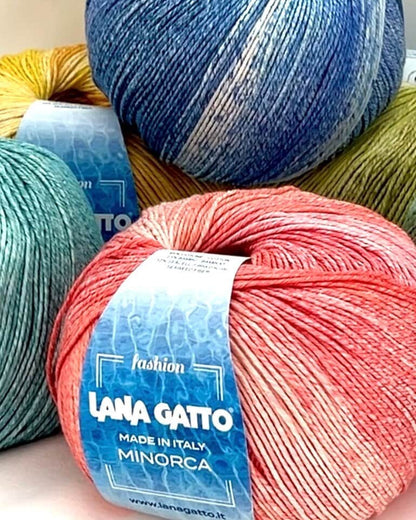 Luxury Italian designer yarn collection for iDOKNiT, featuring premium natural fibers on cones for professional hand-knit and machine-knitting projects.