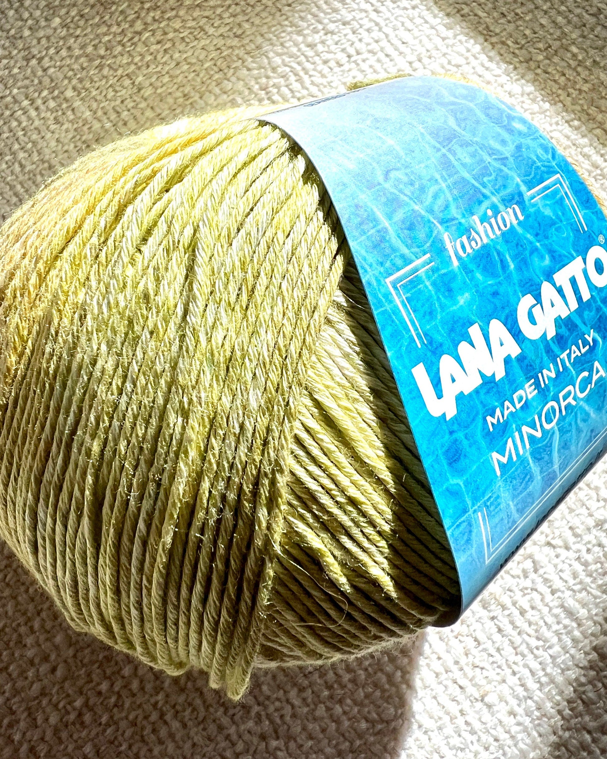 Luxury Italian designer yarn collection for iDOKNiT, featuring premium natural fibers on cones for professional hand-knit and machine-knitting projects.