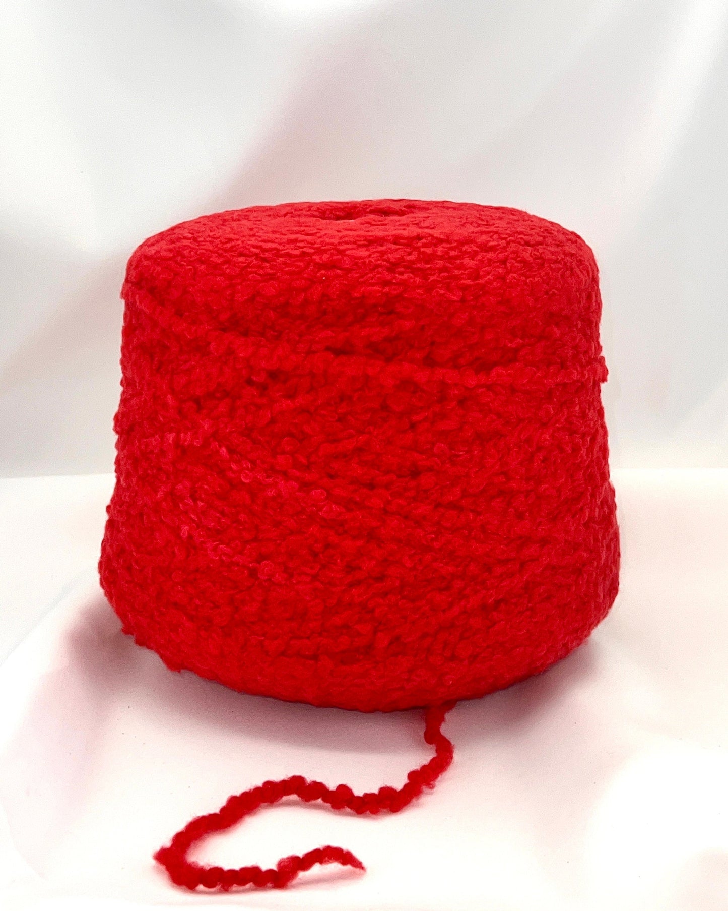 Red yarn ball on a white background