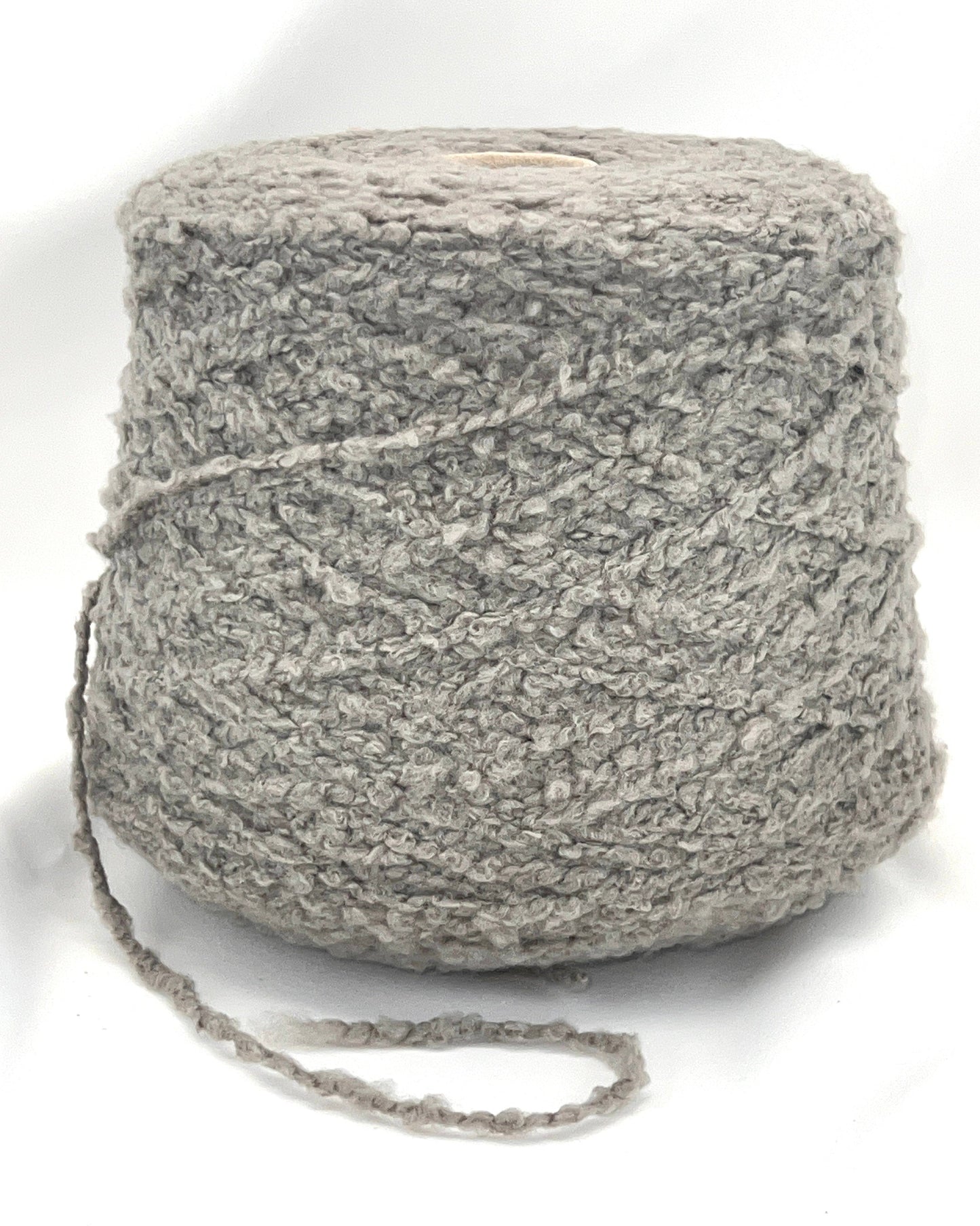 Ball of gray yarn on a white background