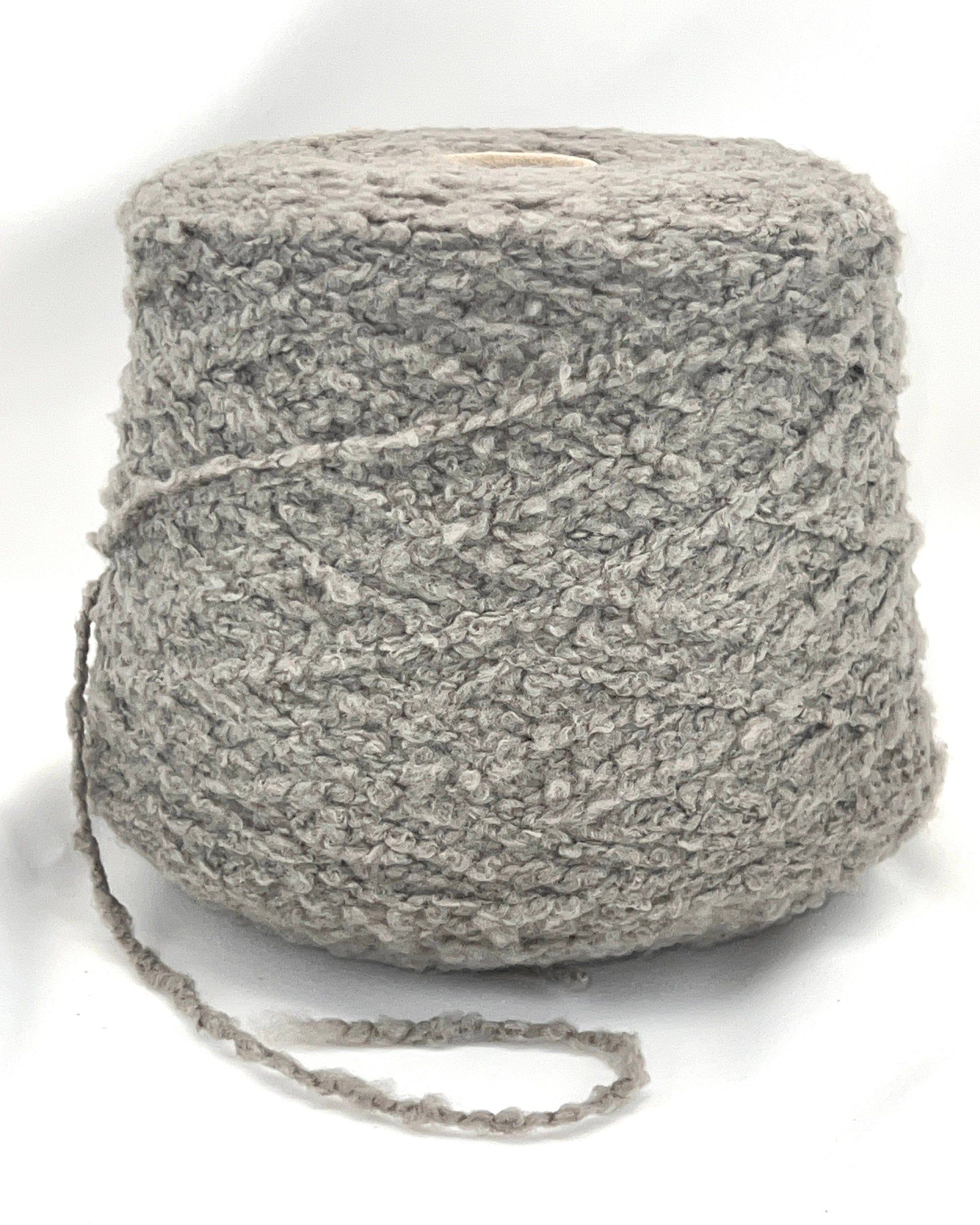 Ball of gray yarn on a white background