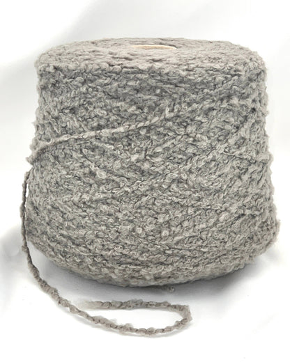 Ball of gray yarn on a white background