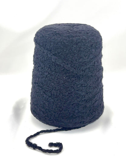 Blue skein of yarn on a white background
