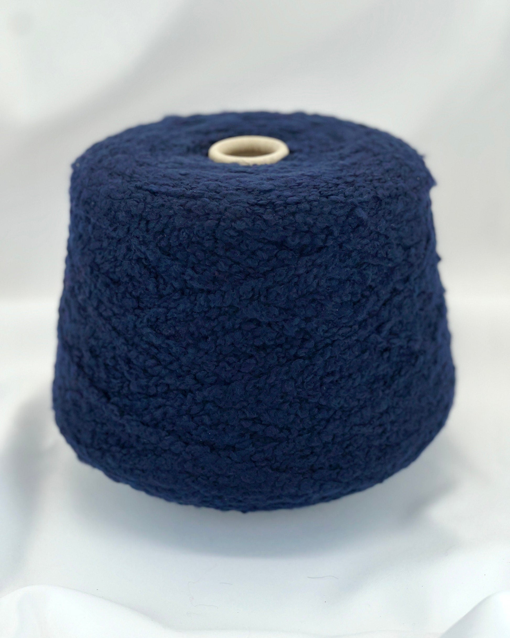 Navy blue yarn on a white background