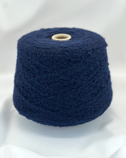 Navy blue yarn on a white background