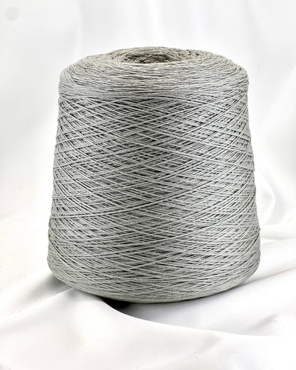 Gray spool of yarn on a white background