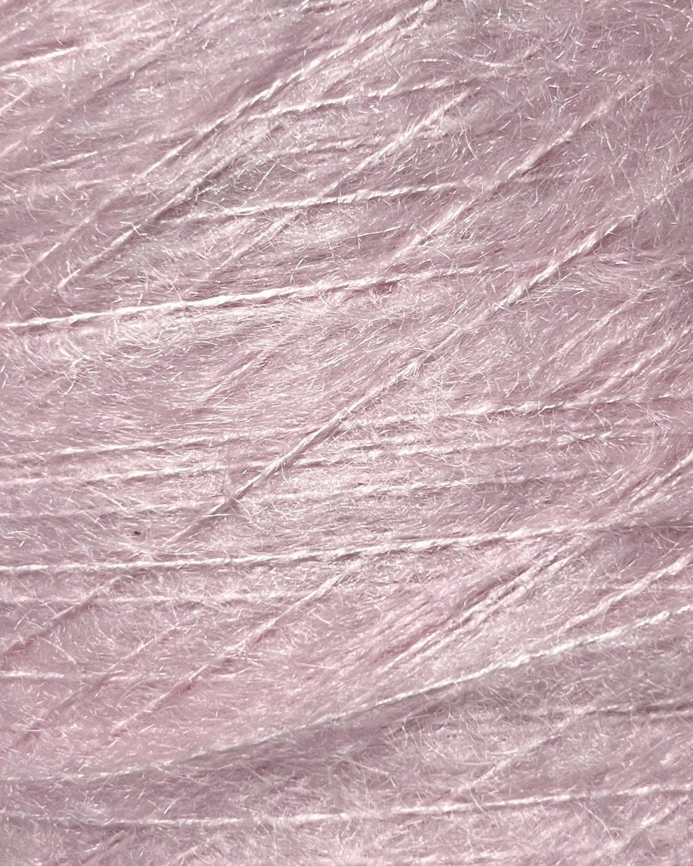 Close-up of a textured pink fabric surface