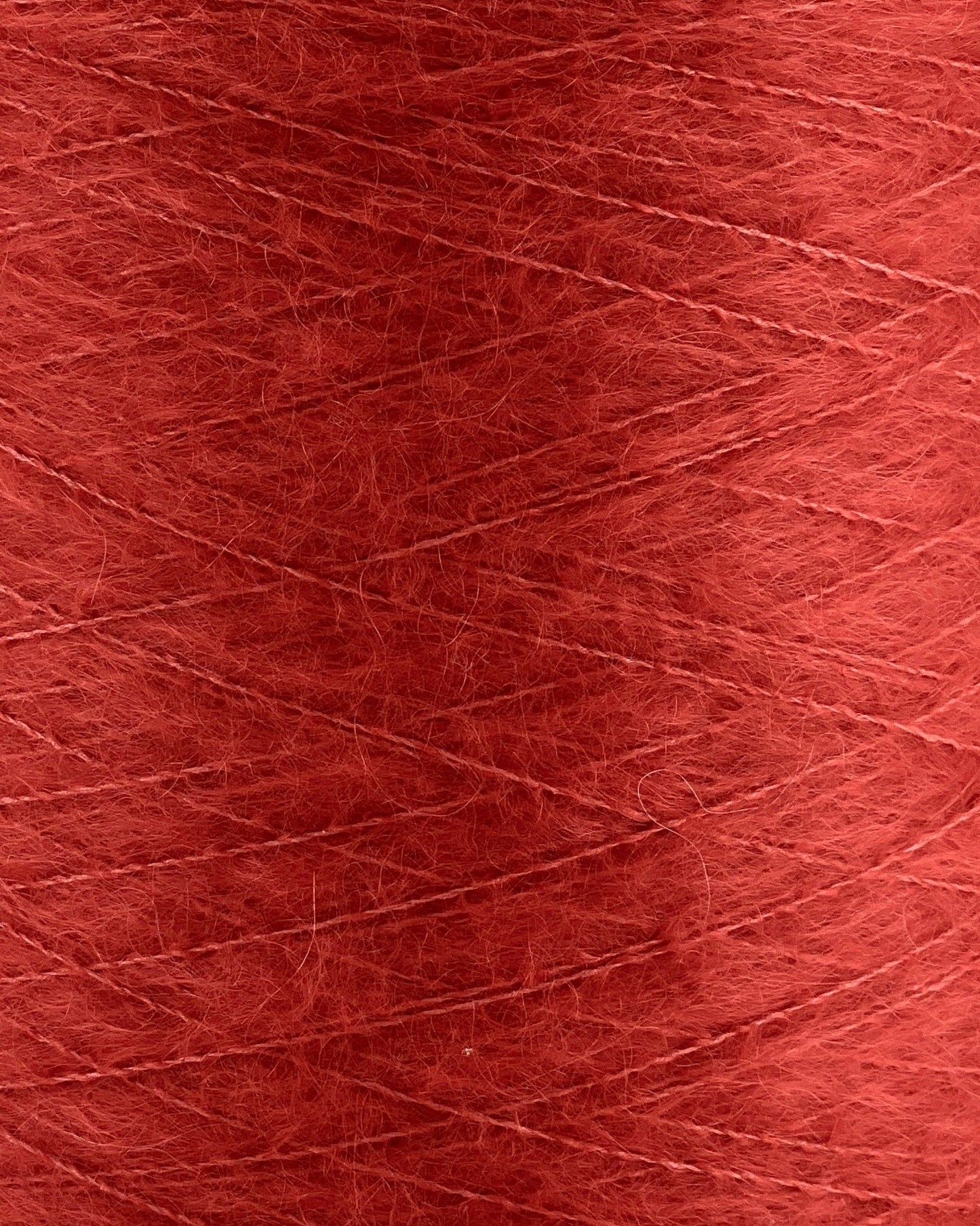 Close-up of red yarn with visible texture