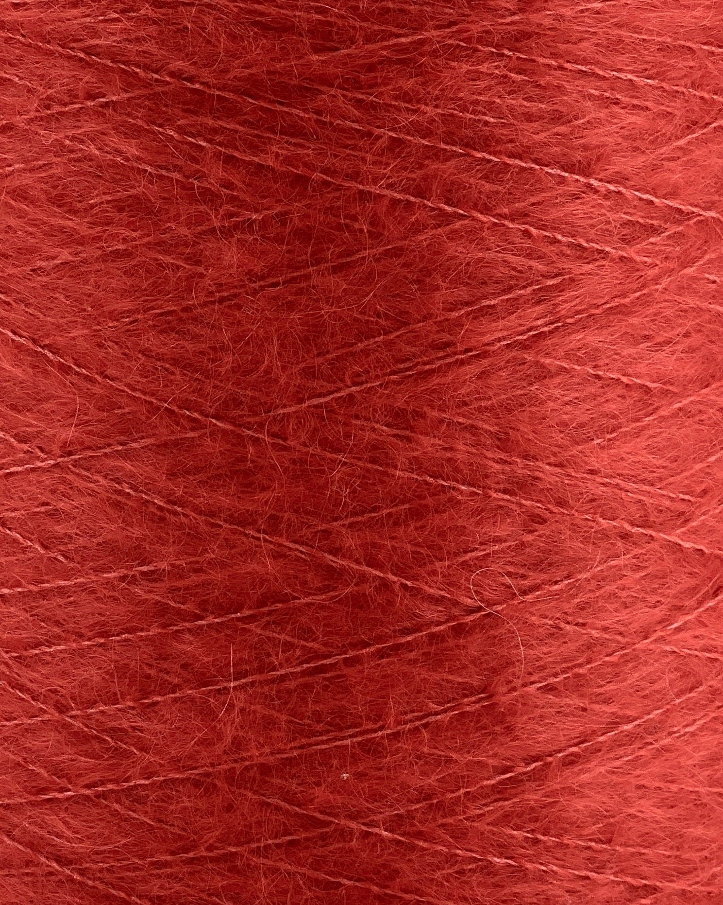 Close-up of red yarn with visible texture