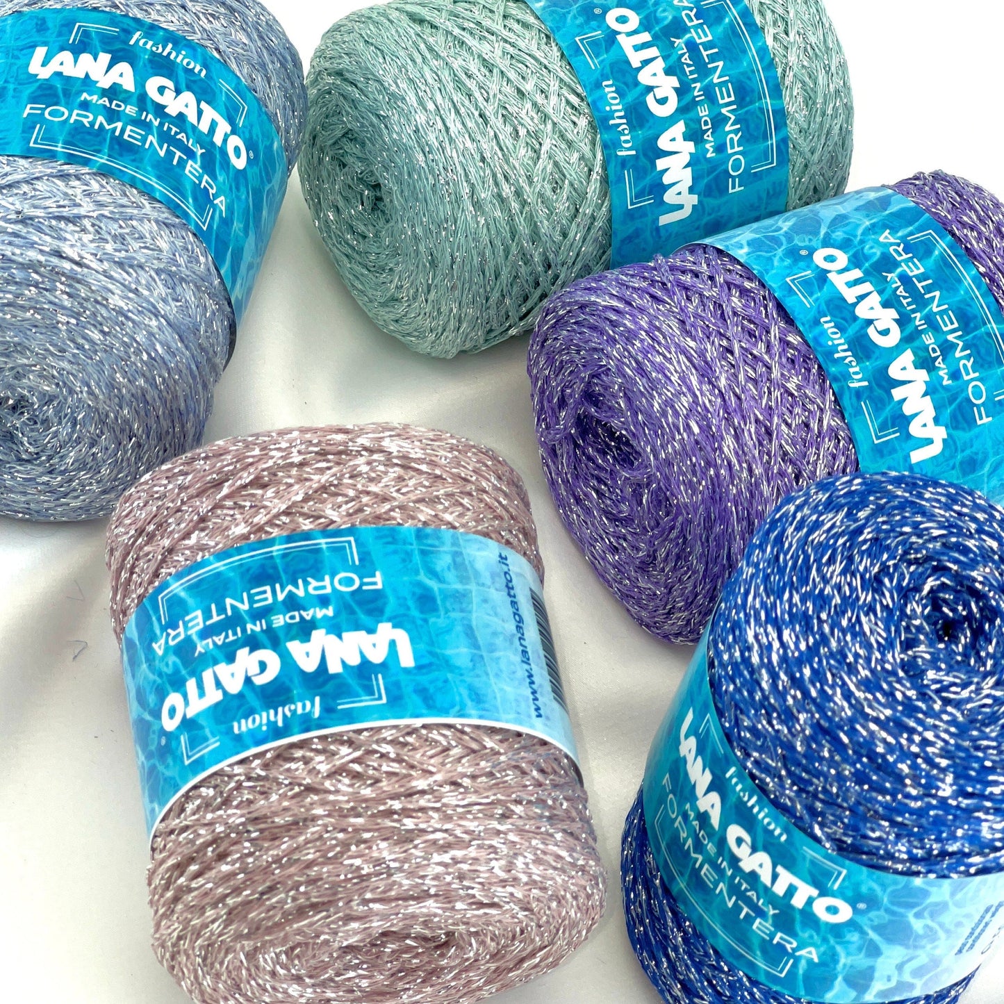 Luxury Italian designer yarn collection for iDOKNiT, featuring premium natural fibers on cones for professional hand-knit and machine-knitting projects.