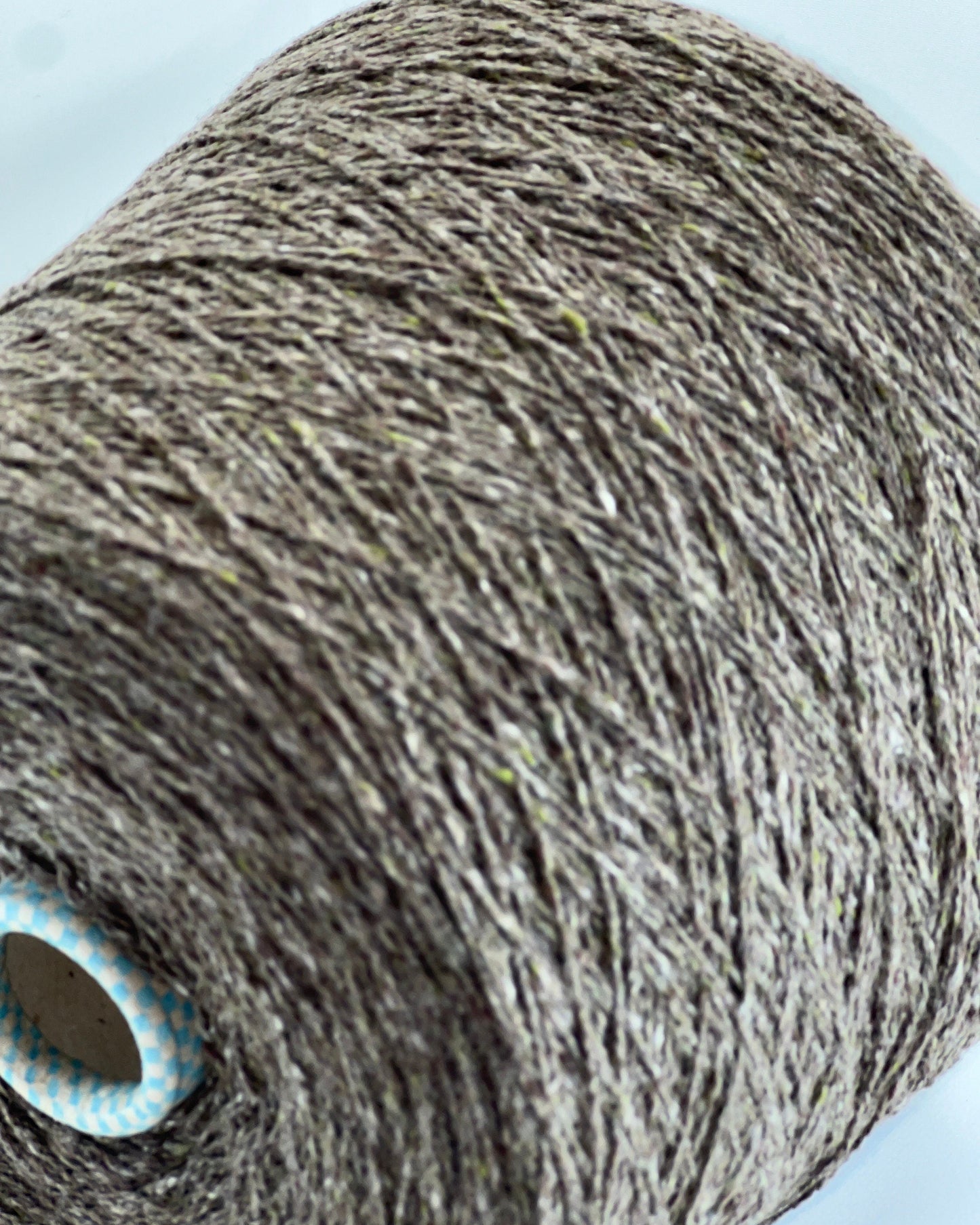 Cariaggi NEW HARRIS cashmere tweed yarn cone Italy
100 percent cashmere tweed yarn taupe melange with green flecks
Luxury Italian cashmere tweed yarn for sweaters scarves and shawls
soft fingering weight cashmere yarn texture close up
Cariaggi NEW HARRIS luxury yarn 400m per 100g