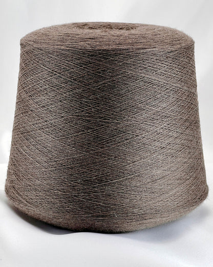 Large spool of brown yarn on a white background