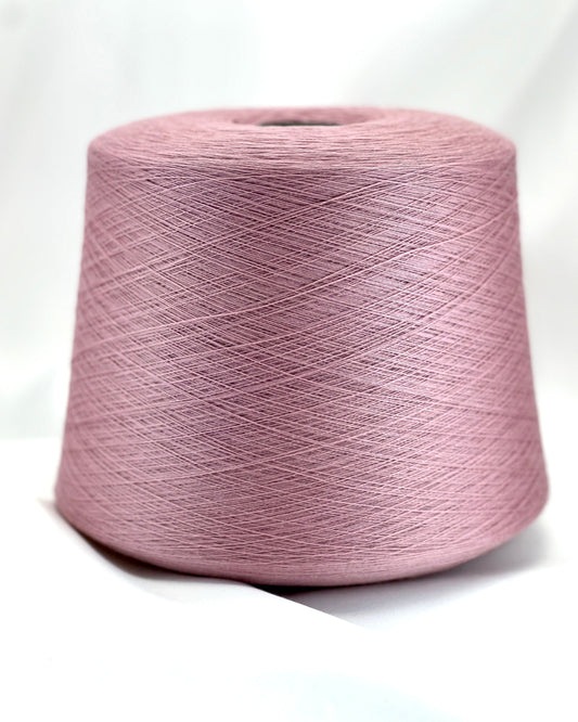 Pink spool of yarn on a white background