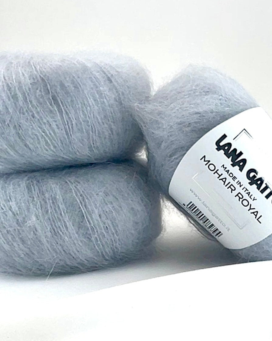 Close-up of iDOKNiT Lana Gatto MOHAIR ROYAL yarn, highlighting the delicate airy halo of Kid Mohair and Extrafine Merino blend in a 25g ball.