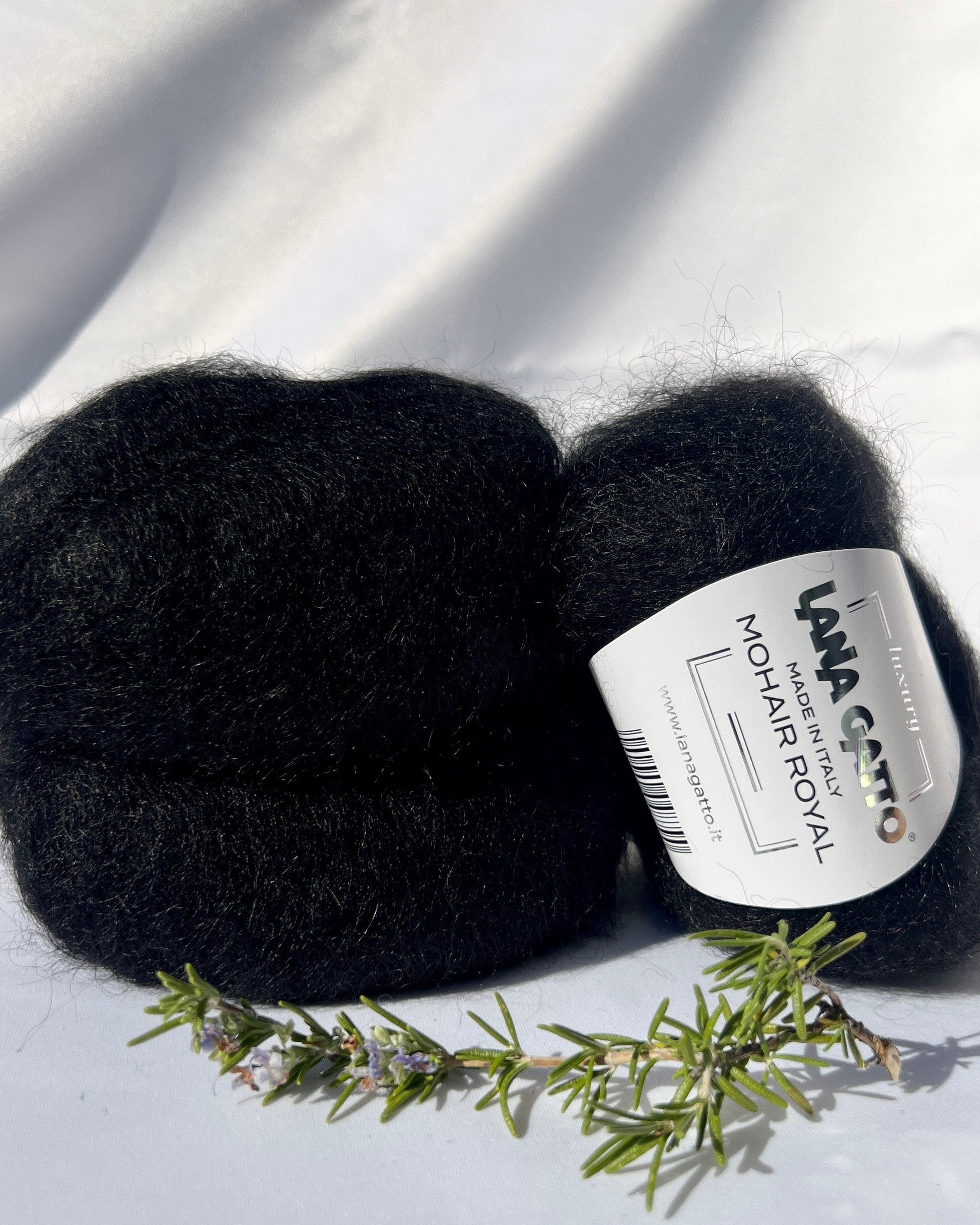 Close-up of iDOKNiT Lana Gatto MOHAIR ROYAL yarn, highlighting the delicate airy halo of Kid Mohair and Extrafine Merino blend in a 25g ball.