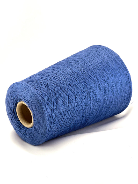 Blue spool of thread on a white background