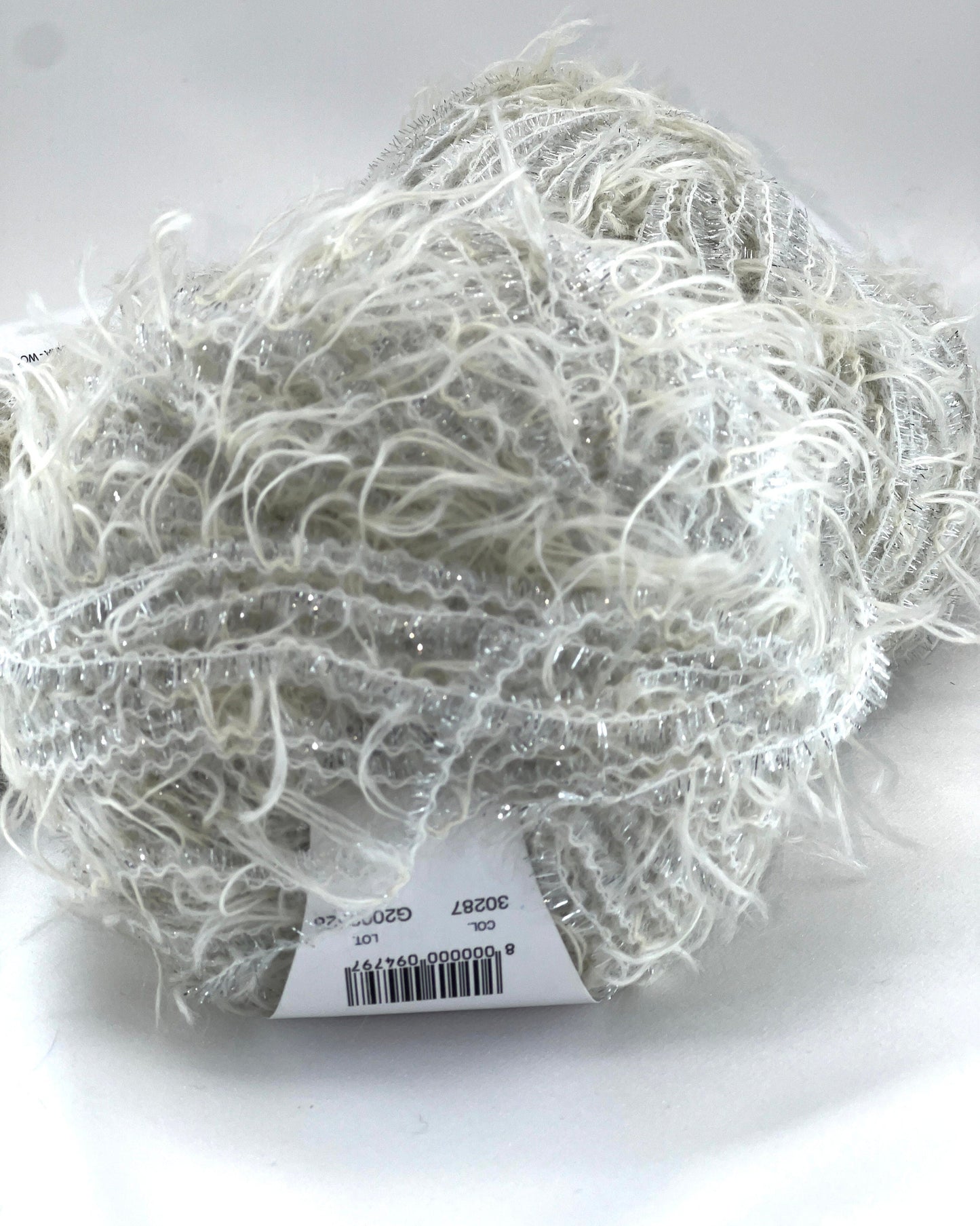 Ball of yarn with a label on a white background
