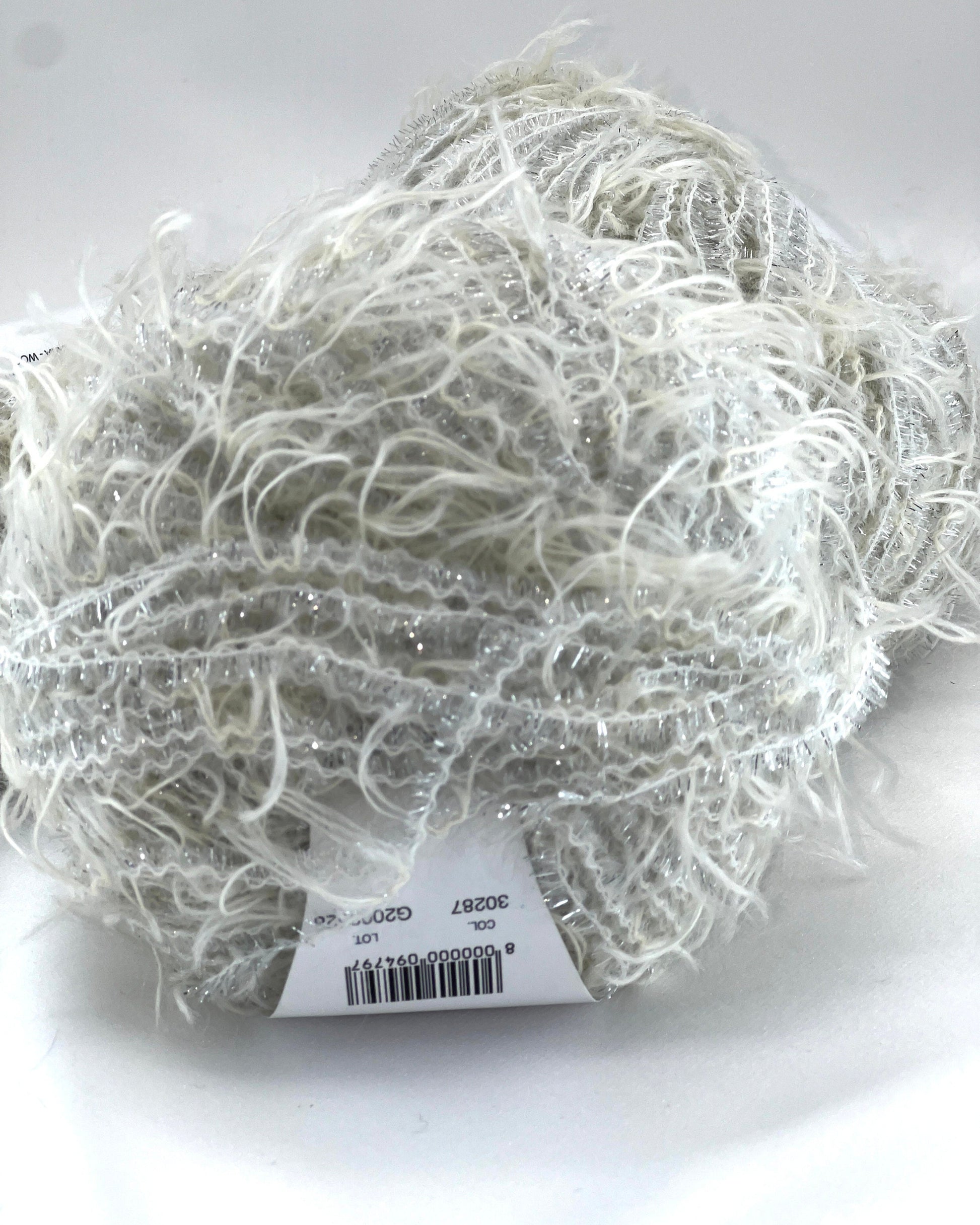Ball of yarn with a label on a white background