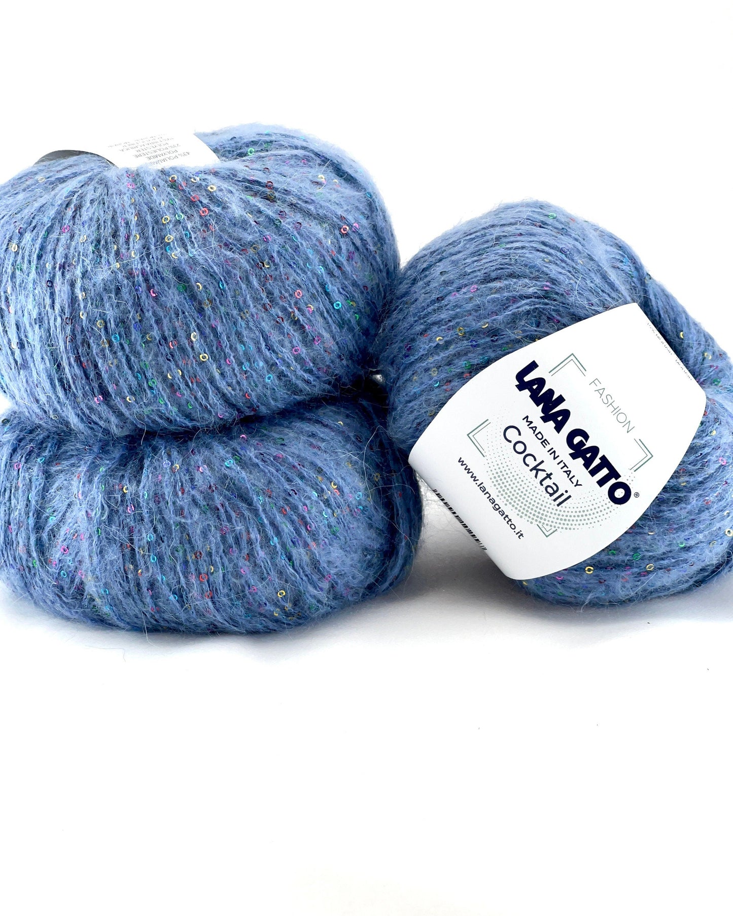 Two skeins of blue yarn with a Lana Grossa label on a white background