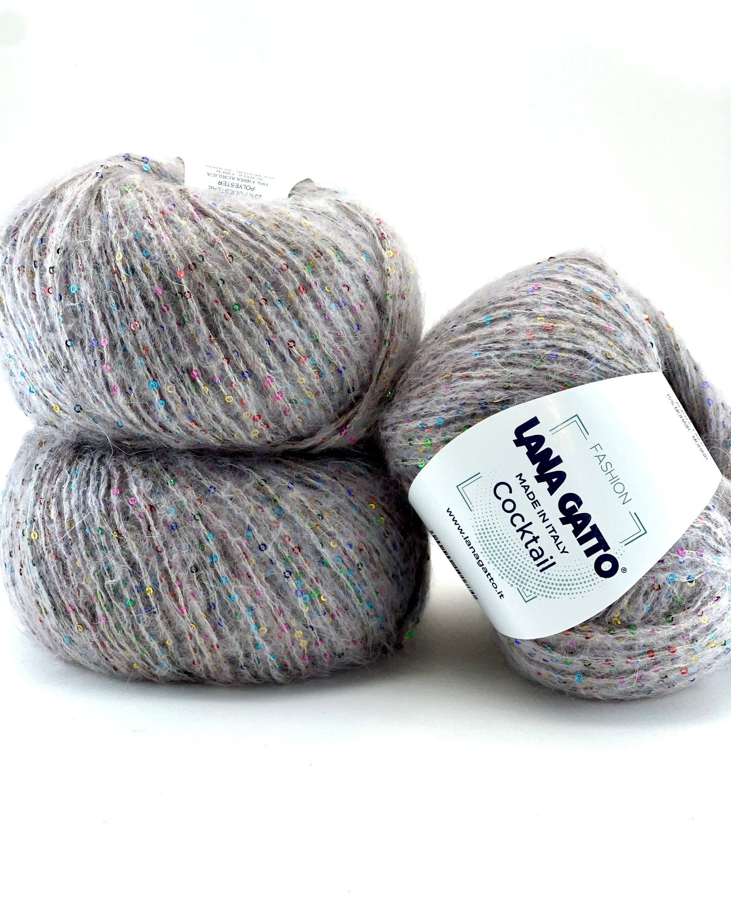 Two balls of gray yarn with a label on a white background