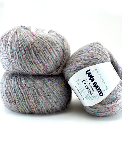 Two balls of gray yarn with a label on a white background