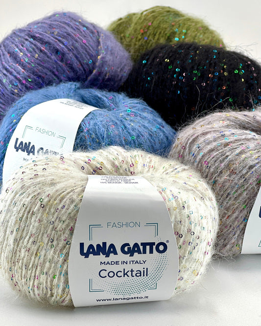 Five balls of yarn in different colors with 'Lana Gatto' labels on a white background