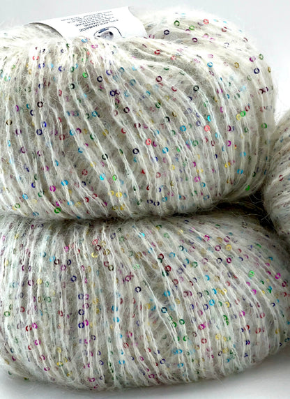 Two skeins of yarn with multicolored speckles on a white background