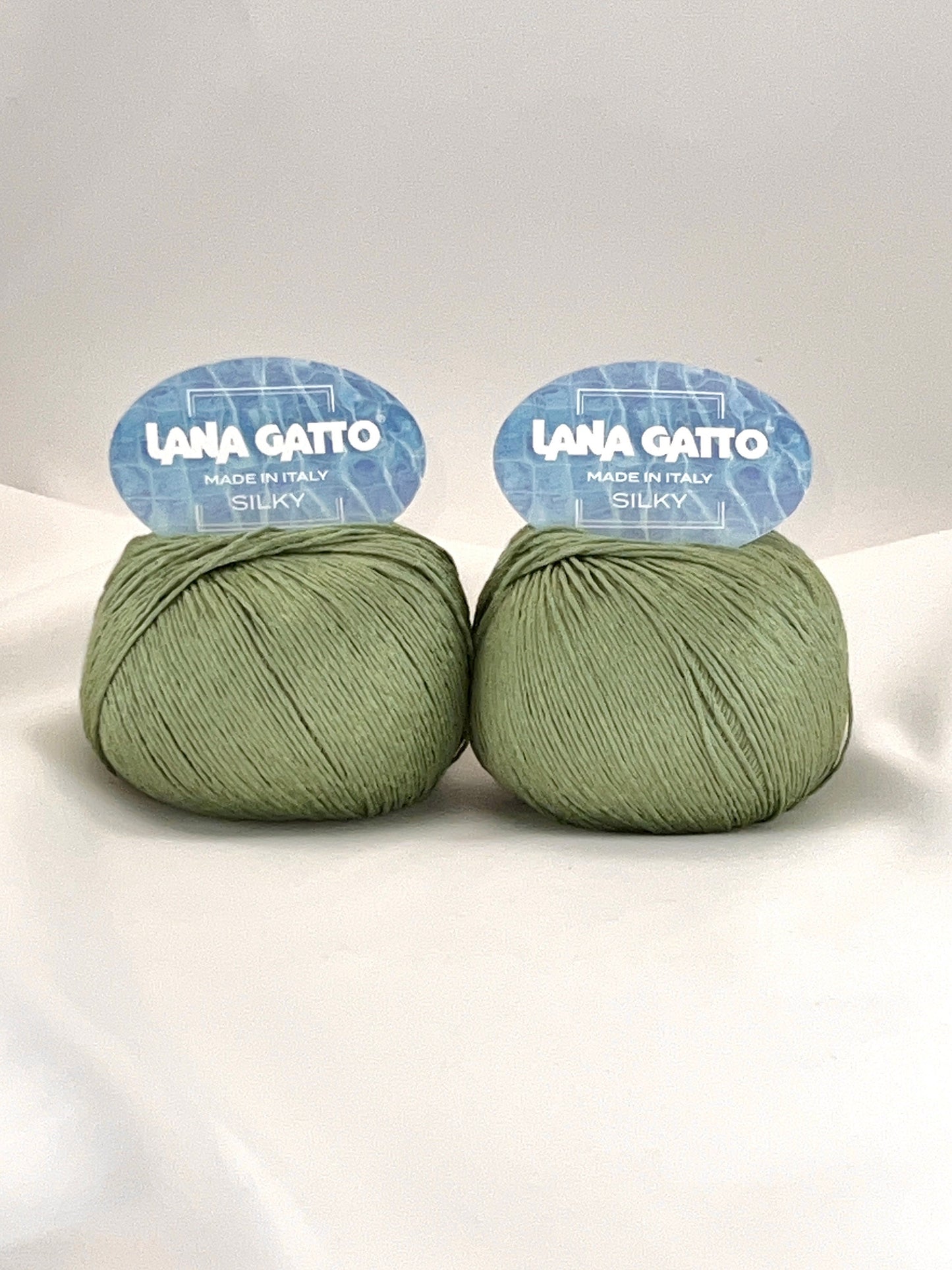 Lana Gatto SILKY pure silk yarn Italian fingering yarn
Luxury silk yarn for elegant summer knitwear and shawls
Close up of SILKY yarn showing smooth plied silk texture
Italian pure silk yarn with elegant sheen and drape
Soft breathable silk yarn for luxury knitting projects