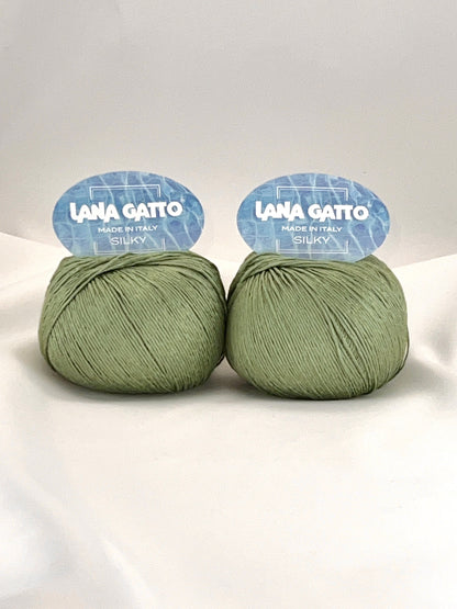 Lana Gatto SILKY pure silk yarn Italian fingering yarn
Luxury silk yarn for elegant summer knitwear and shawls
Close up of SILKY yarn showing smooth plied silk texture
Italian pure silk yarn with elegant sheen and drape
Soft breathable silk yarn for luxury knitting projects