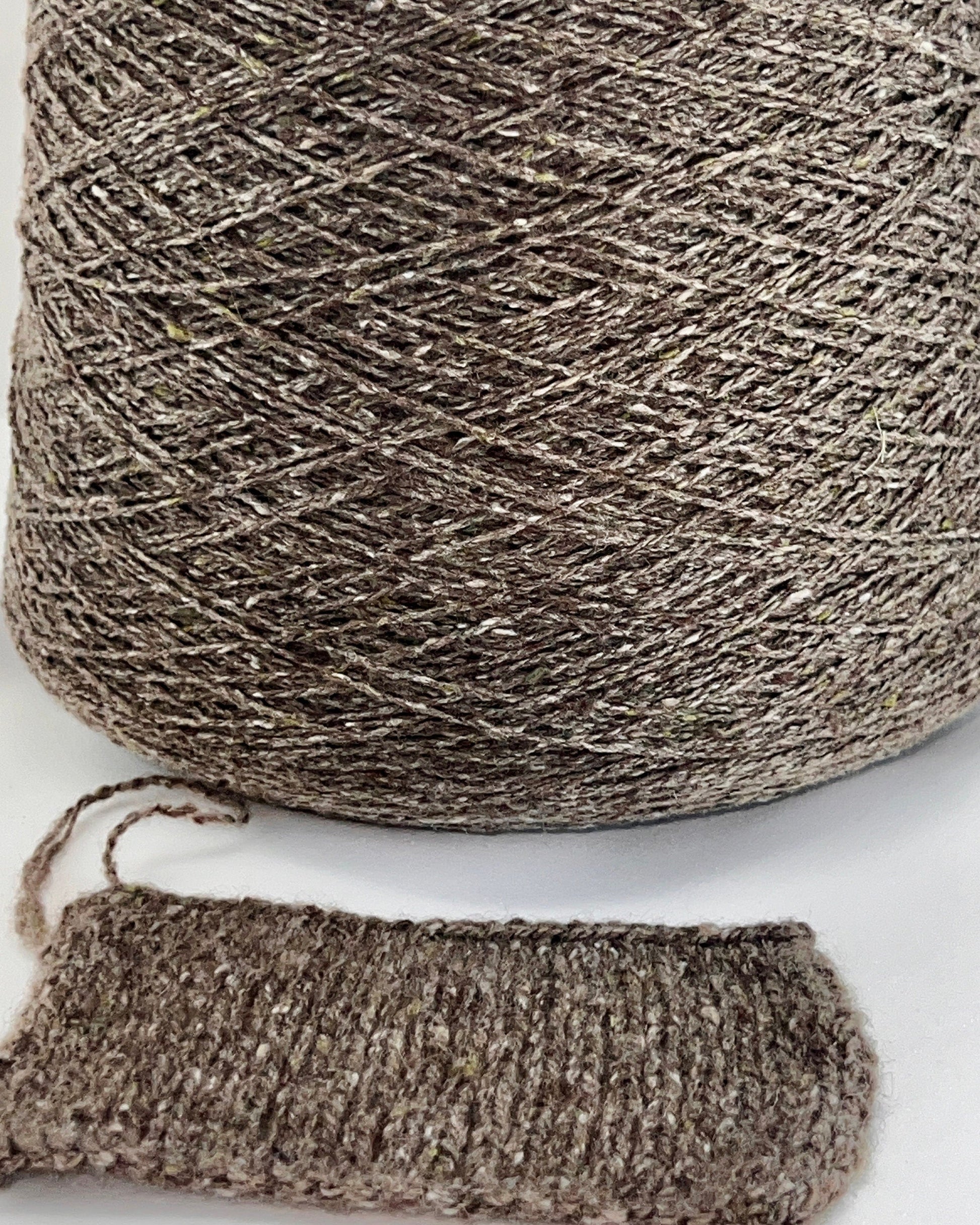 Cariaggi NEW HARRIS cashmere tweed yarn cone Italy
100 percent cashmere tweed yarn taupe melange with green flecks
Luxury Italian cashmere tweed yarn for sweaters scarves and shawls
soft fingering weight cashmere yarn texture close up
Cariaggi NEW HARRIS luxury yarn 400m per 100g