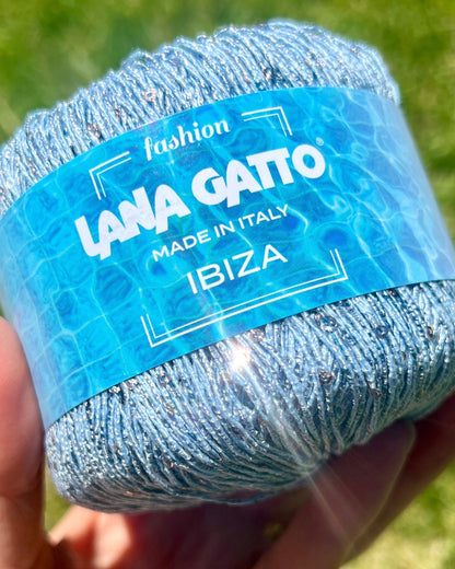 Lana Gatto IBIZA lurex cotton paillettes yarn with elegant sparkle
Italian fingering yarn IBIZA with micro sequins and metallic accents
Lana Gatto IBIZA summer yarn showing light-catching shimmer and texture
Lurex cotton paillettes yarn for beachwear summer tops and shawls
Luxury Italian IBIZA yarn for statement accessories and warm-weather knitwear