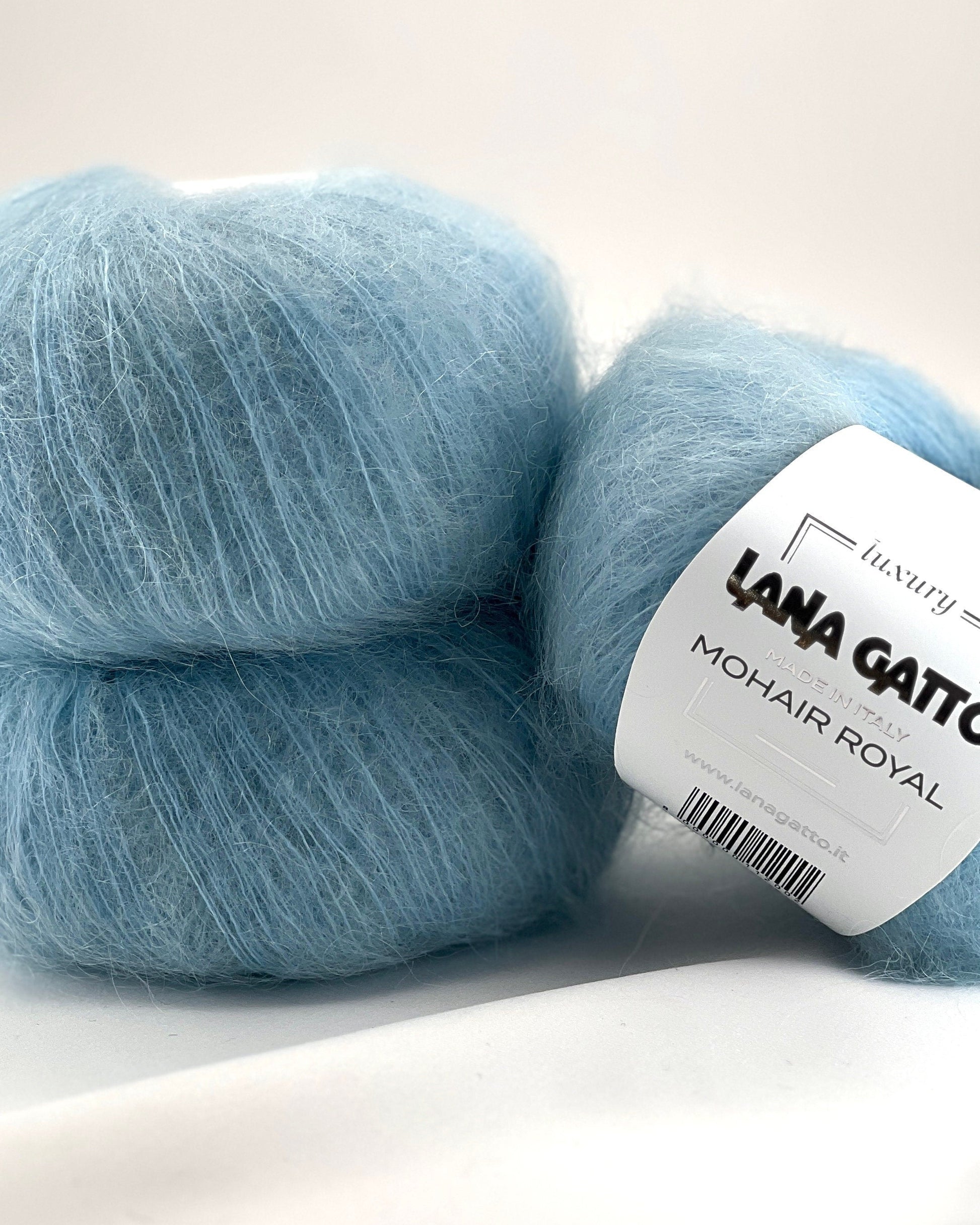 Close-up of iDOKNiT Lana Gatto MOHAIR ROYAL yarn, highlighting the delicate airy halo of Kid Mohair and Extrafine Merino blend in a 25g ball.