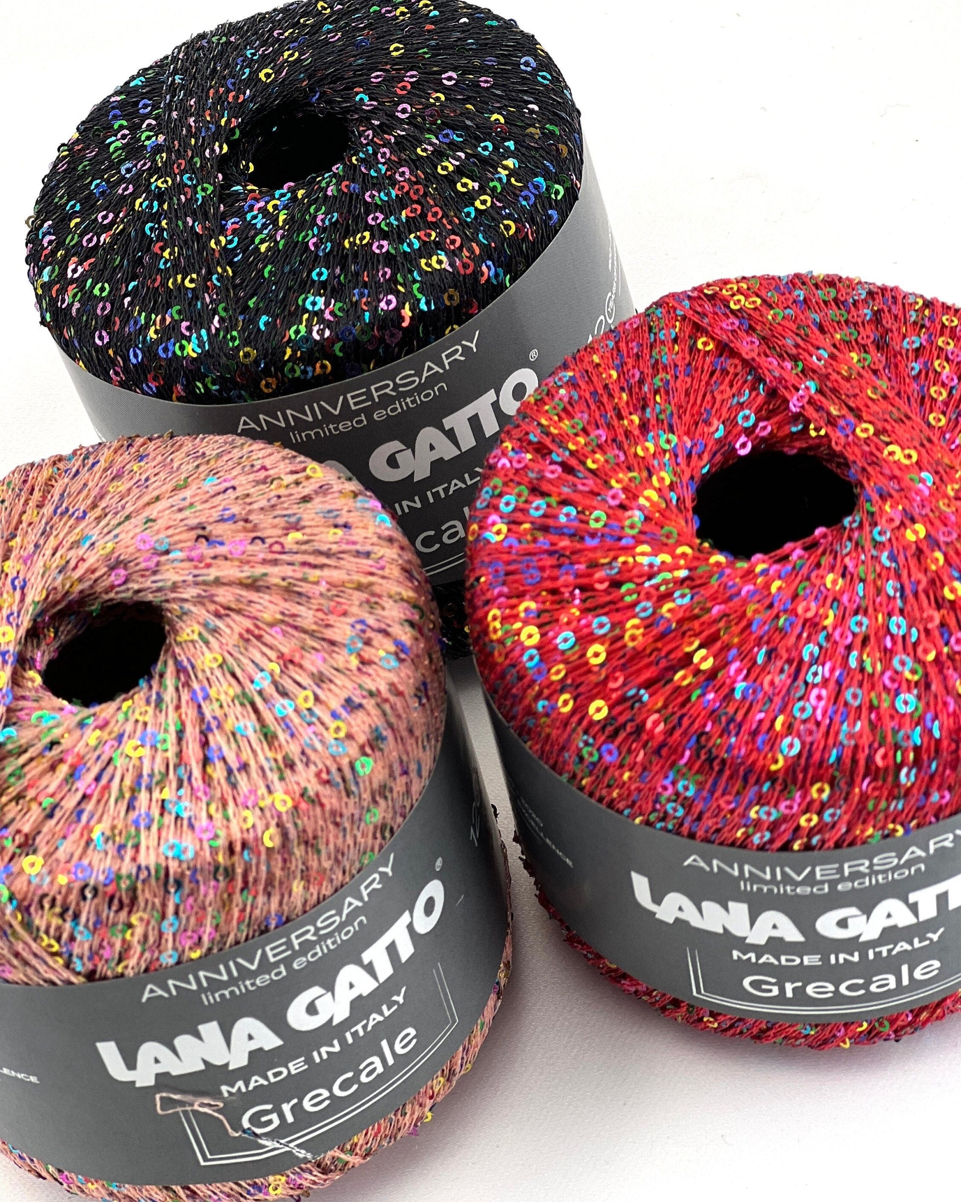 Three skeins of colorful yarn with 'Lana Gatto' labels on a white background
