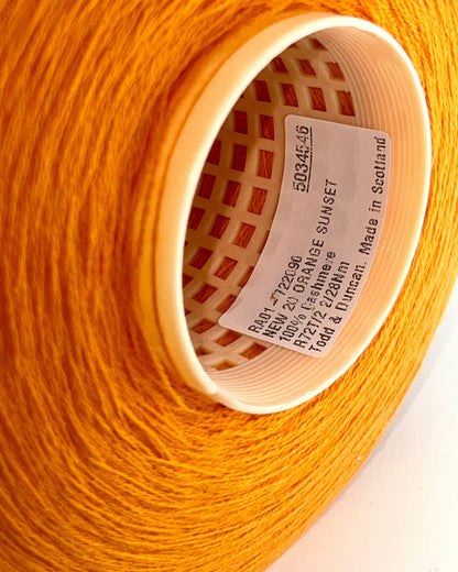 Todd & Duncan 100% Cashmere yarn (2/28 Nm) in a soft neutral palette. Shown as high-quality 2-ply lace weight thread on cones. Made in Scotland. Premium luxury yarn for retail at iDOKNiT.com.