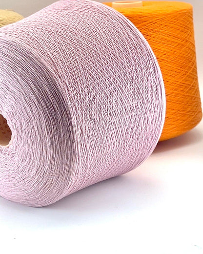 Todd & Duncan 100% Cashmere yarn (2/28 Nm) in a soft neutral palette. Shown as high-quality 2-ply lace weight thread on cones. Made in Scotland. Premium luxury yarn for retail at iDOKNiT.com.