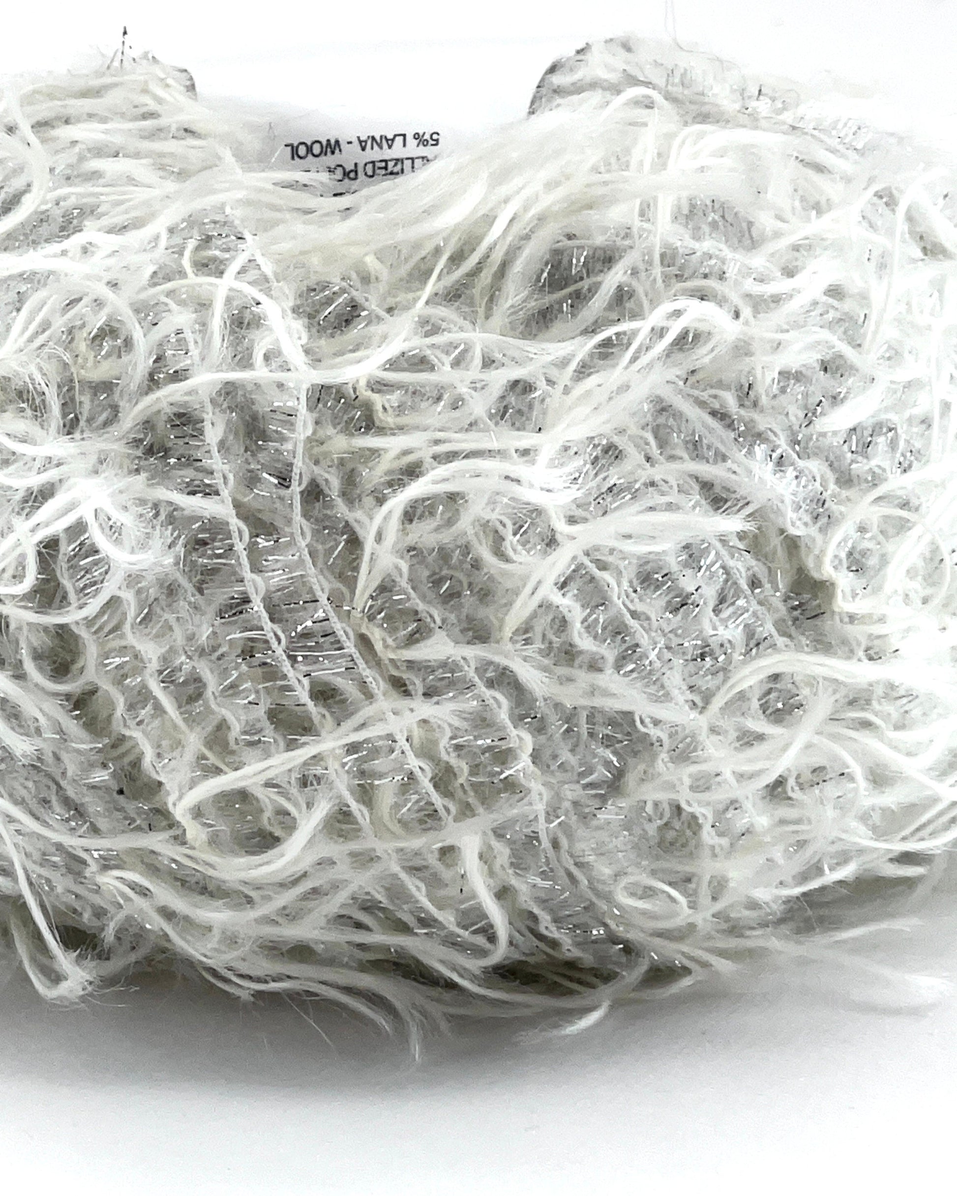 Ball of white yarn on a white background