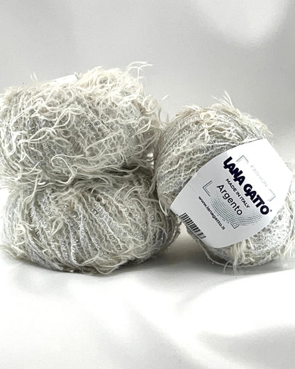 Two balls of yarn with a label on a white background