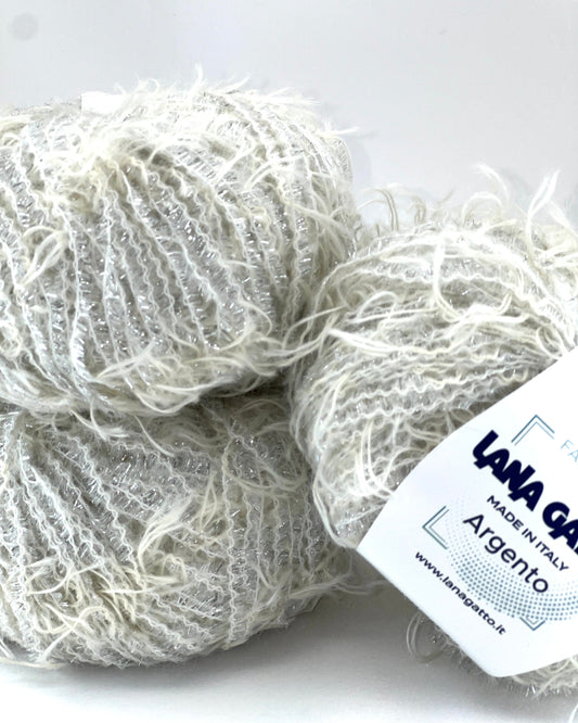 Ball of yarn with a label on a white background