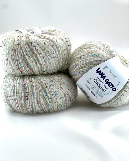 Three balls of yarn with a label on a white background