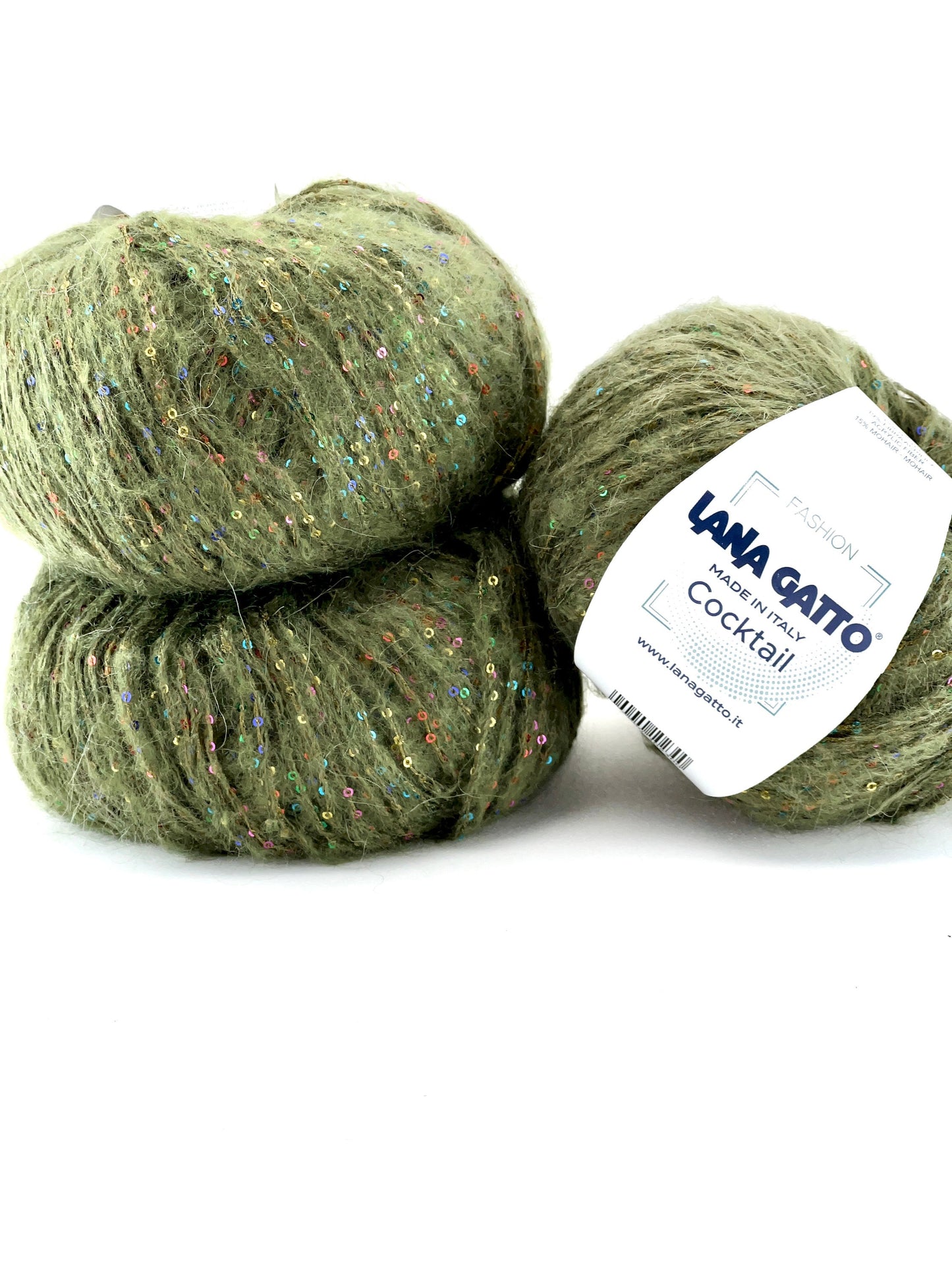 Three skeins of green yarn with a label on a white background